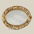 Espejo ovalado con marco de madera perforada en pan de oro Made in Italy - Florence