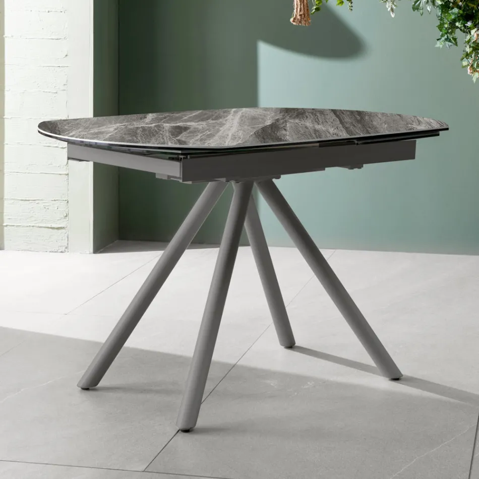 Mesa extensible hasta 180 cm en cerámica sobre vidrio y metal - Lozzolo Viadurini