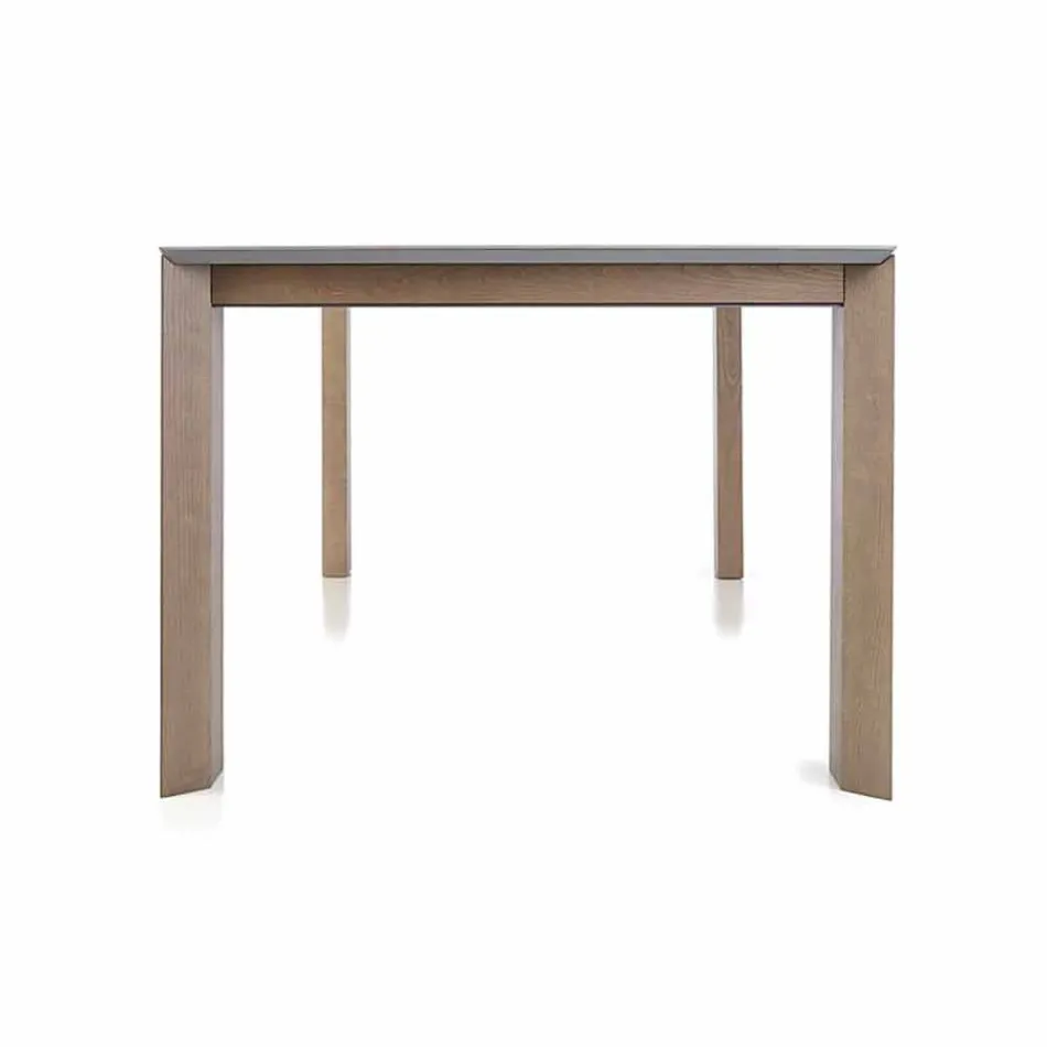 Mesa extensible hasta 300 cm en cerámica y patas de madera - Ipanemo Viadurini