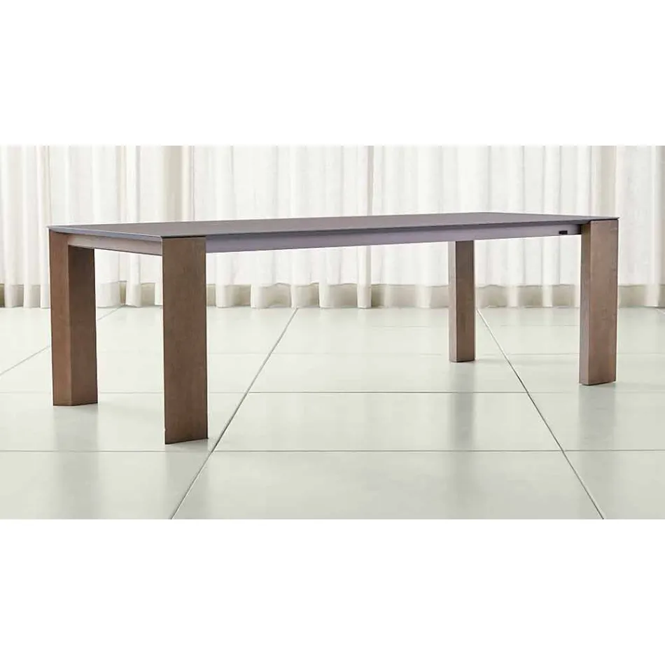 Mesa extensible hasta 300 cm en cerámica y patas de madera - Ipanemo Viadurini
