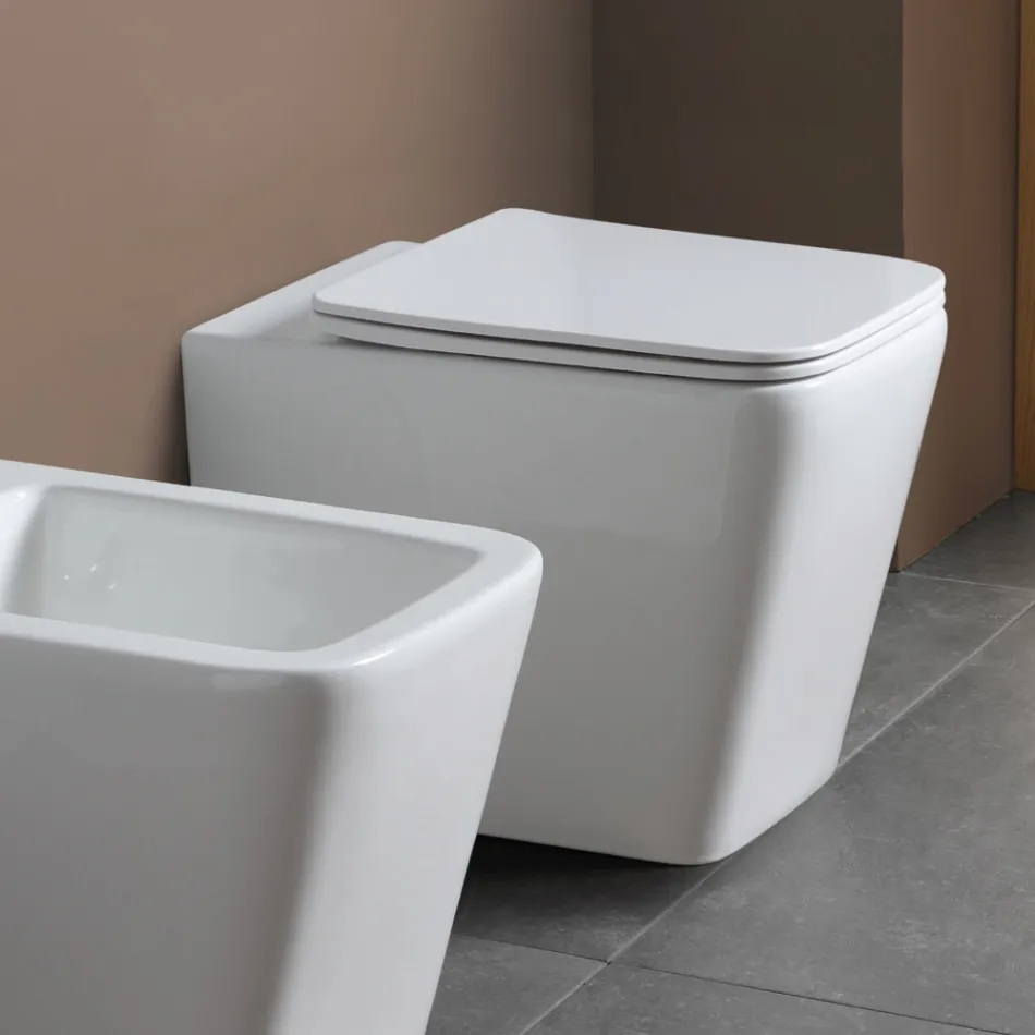 Inodoro de pie con asiento cerámico de cierre suave y diseño moderno - Giunco Viadurini