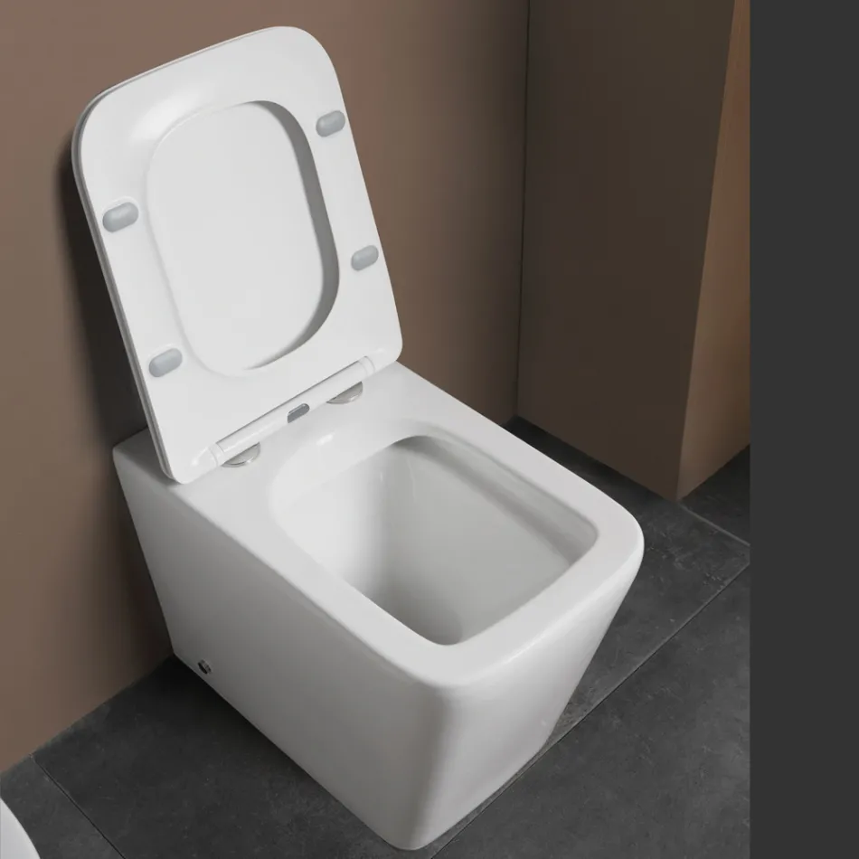 Inodoro de pie con asiento cerámico de cierre suave y diseño moderno - Giunco Viadurini